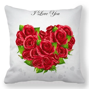 Detail of red rose heart pattern with I Love You text on a white square pillow cover