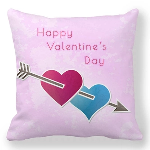 Detail view of pink peach skin pillow cover with Happy Valentine's Day text and heart print