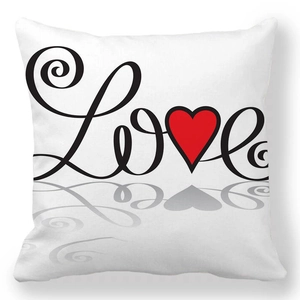 Detailed close-up of soft peach skin pillowcase with black Love text and red heart
