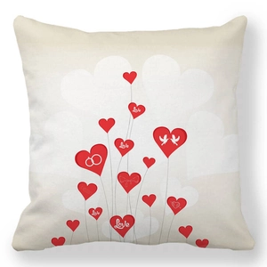 Detail of peach skin pillowcase featuring red heart balloons and Love lettering