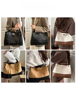 Detail view of large quilted tote bags with chain straps in multiple colorways on models