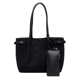 Minimalist black faux suede large tote bag with a small zippered pouch for daily commute