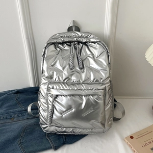 Chic silver quilted backpack with spacious compartments and woven grey zipper pulls
