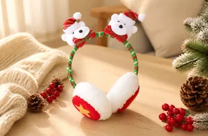 Detail of Christmas plush earmuffs with red-green stripes and bear decorations