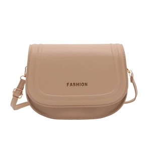 Minimalist beige leather saddle bag with gold fashion lettering and adjustable strap