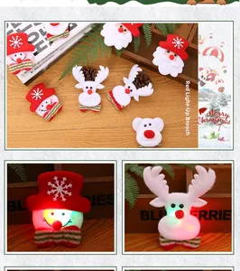 Close-up of LED glowing Christmas brooches featuring Santa, snowman, and reindeer shapes
