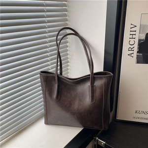 Vintage brown large capacity tote bag with minimalist slim straps and leather texture