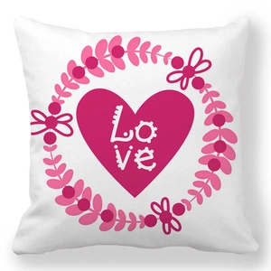 Detailed view of white square pillowcase featuring a pink floral heart and Love text