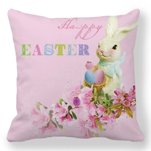 Detail of pink Easter pillow case with white rabbit, colorful eggs and floral patterns