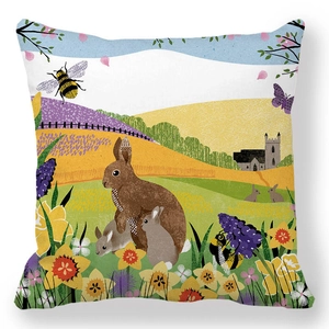 Detail of peach skin pillowcase with Easter bunnies, daffodils, and European church landscape