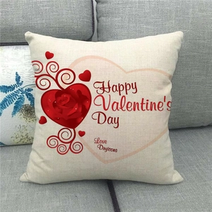 Close-up of linen Valentine's Day pillow cover with heart rose print on a sofa
