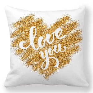 Détail du motif cœur doré scintillant et du texte Love you sur la taie d'oreiller blanche