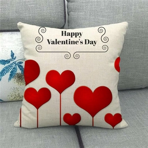 Linen Valentine's Day pillowcase with red heart balloons on a gray fabric sofa