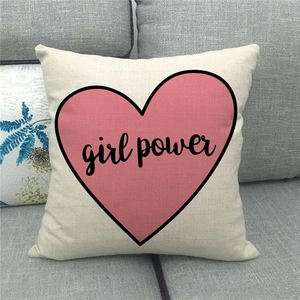 Detail of linen cushion cover showing woven texture and pink heart Girl Power print