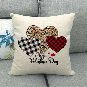 Close-up of linen Valentine's Day pillowcase with leopard and plaid heart patterns