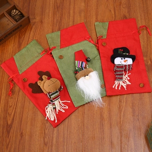 Three assorted Christmas drawstring gift bags featuring 3D Santa, reindeer and snowman dolls