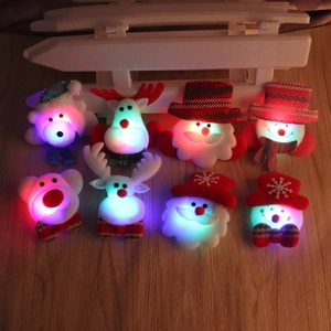 Set of 8 glowing Christmas brooches featuring Santa, reindeer, and snowman icons