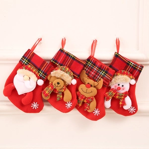 Detailed view of 4-pack Christmas stockings featuring 3D Santa, bear, elk, and snowman motifs