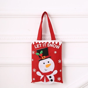 Detail of red felt Christmas gift bag featuring snowman applique and Let It Snow text