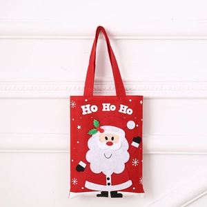 Detail of red felt Christmas gift bag featuring 3D Santa Claus and Ho Ho Ho text