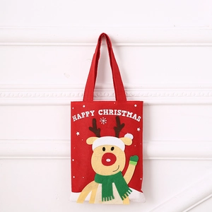 Detail of red felt Christmas gift bag featuring cartoon reindeer and Happy Christmas text