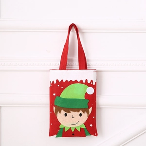 Close-up of red Christmas elf felt gift bag with colorful applique embroidery detail