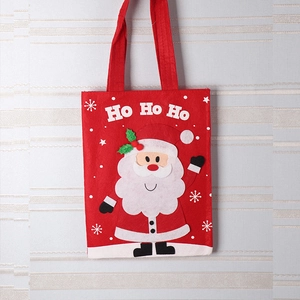 Detail of red Christmas felt bag with Santa Claus appliqué and Ho Ho Ho text