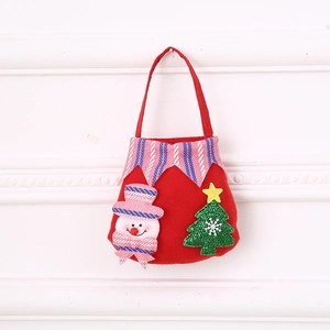 Detail of red Christmas felt bag with 3D snowman, green tree, and striped trim