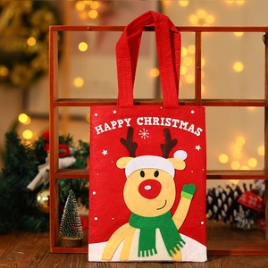 Christmas gift bag with cartoon reindeer design and Happy Christmas text on red felt material