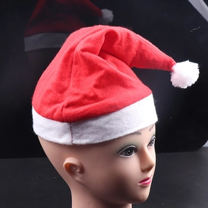 Classic red plush Santa hat with white fur trim and pom-pom shown on a mannequin head