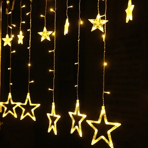 Star LED curtain string lights with warm yellow hanging pentagrams for holiday decor
