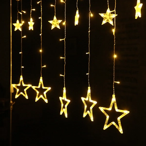 Close-up of LED star curtain lights with warm white glowing stars for holiday decor