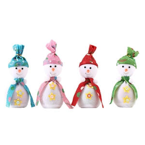 Set of 4 Christmas snowman gift bags in blue, pink, red, and green for holiday decoration