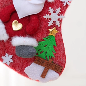 Detail of Christmas stocking featuring 3D Santa, green tree, and Merry Christmas sign