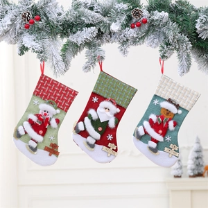Set of three large Christmas stockings with snowman, Santa, elk and wooden tags