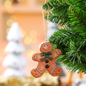 Resin gingerbread man Christmas tree ornament with green bow and colorful candy dots