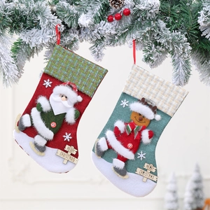 Large Christmas stockings with Santa and Gingerbread man designs and wooden Merry Christmas tags