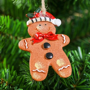 Macro shot of gingerbread man ornament with resin texture on Christmas tree