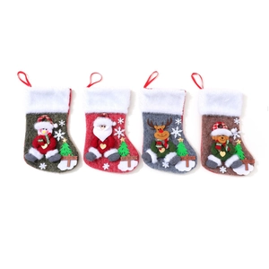 Set of four large Christmas stockings with snowman, Santa, reindeer, and bear motifs