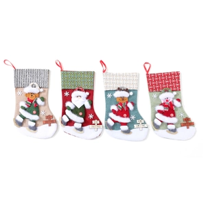 Set of 4 large Christmas stockings with burlap base, wood signs, and classic characters
