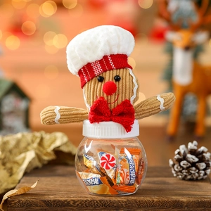 Mini Christmas gingerbread man candy jar with festive knitted hat and clear round base