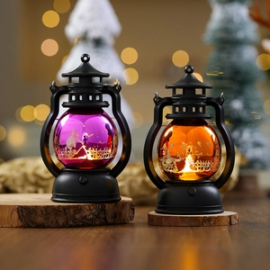 Detail of vintage Halloween lanterns with purple and orange LED glowing pumpkin patterns