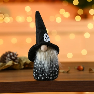 Detail of Halloween gnome with skull hat and star pattern on warm bokeh background