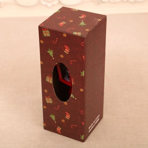Festive red Christmas gift box with holiday patterns and oval window for night lamp