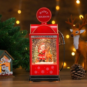 Détail du globe de neige de Noël pompe à essence vintage avec Père Noël et lumières LED
