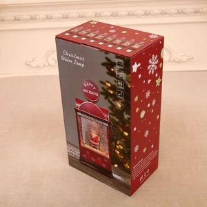 Emballage de la lampe à eau de Noël avec pompe à essence rouge et design du Père Noël