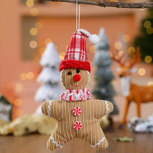 Handmade gingerbread man plush ornament with a red plaid hat for Christmas tree decor