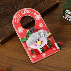 Christmas door hanger with plush snowman and Feliz Navidad greeting on wood backdrop