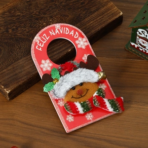 Detail of red Christmas door hanger featuring 3D reindeer and Feliz Navidad text
