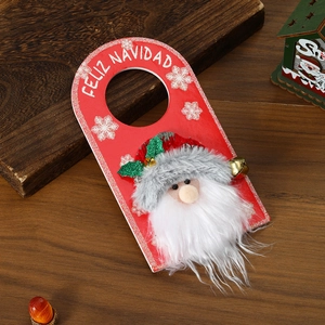 Close-up of Santa Claus door hanger with long white beard and gold bells on red felt